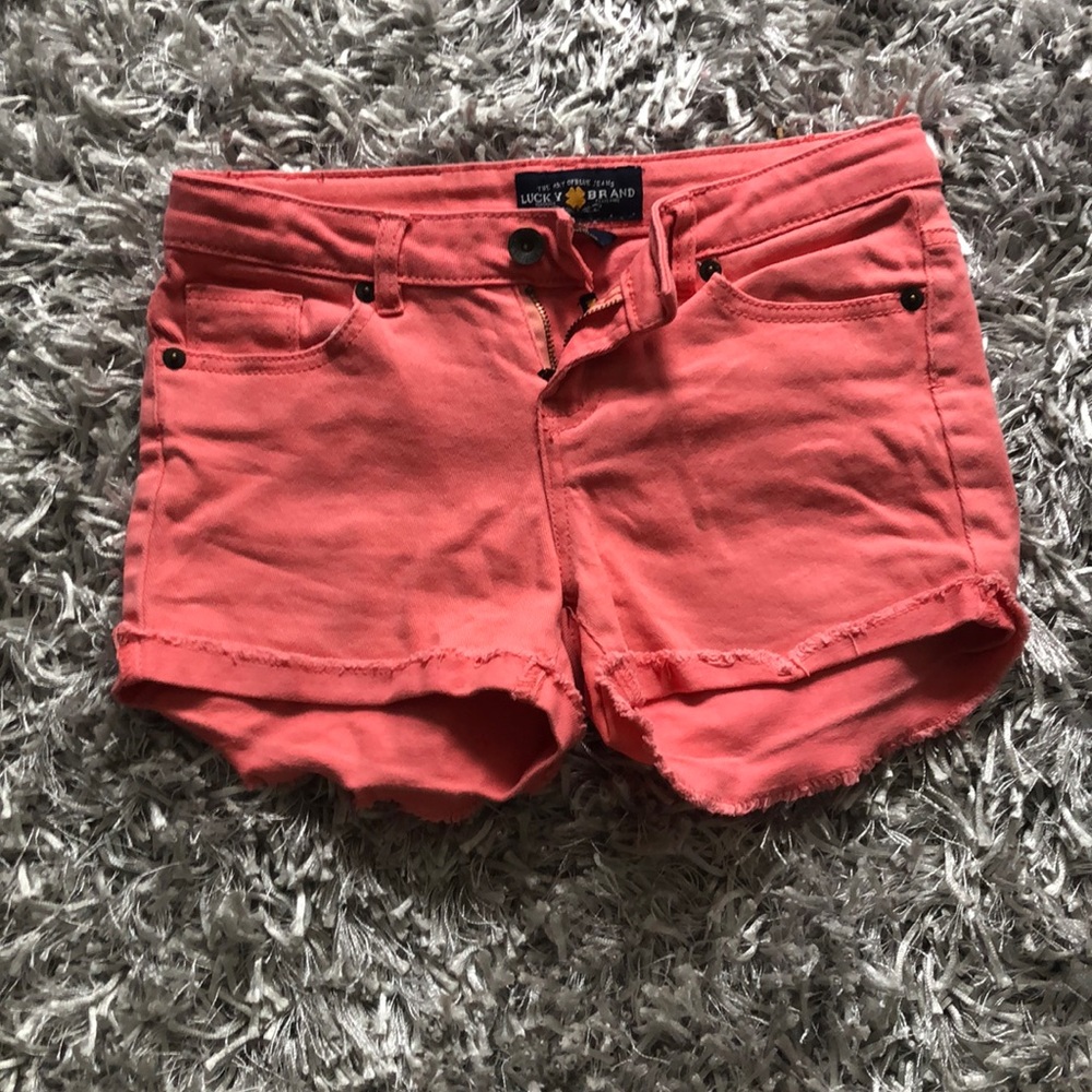 Girl’s coral colored denim shorts